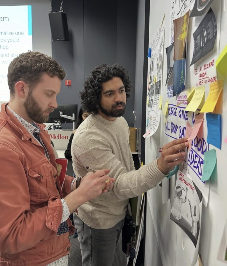 Aidan Terry and Sudarshan Choudhari reading through Composition Box notes left by students at ETC