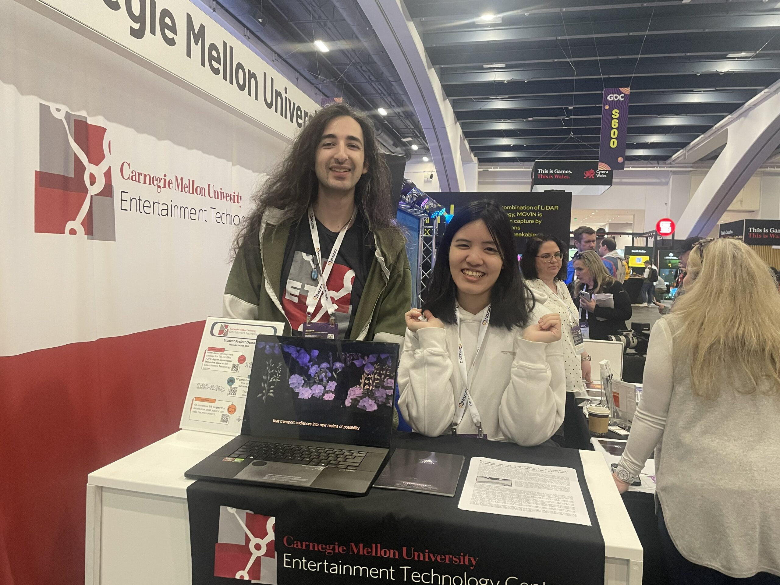 Josh and Winnie standing at ETC booth to showcase Spelunx